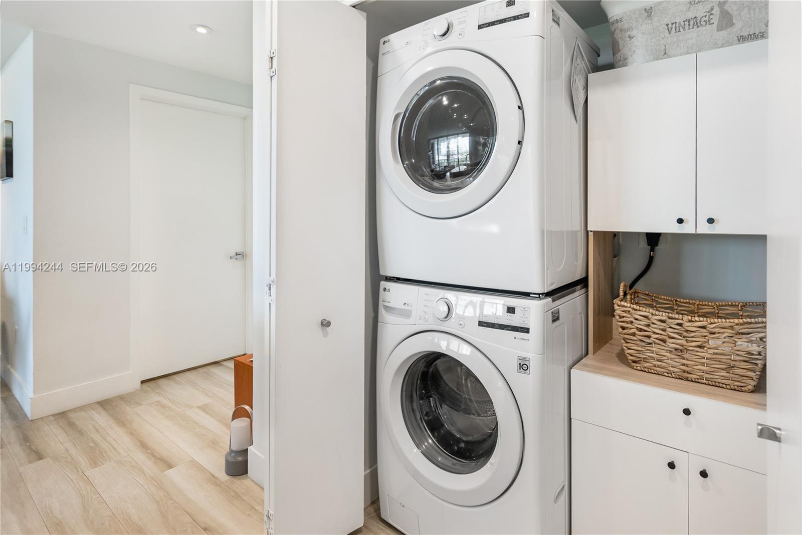 901 Brickell Key Boulevard, Unit 305 Miami, FL 33131 - Photo 22 of 31 a view of entryway with washer and dryer