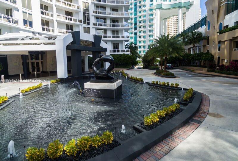 901 Brickell Key Boulevard, Unit 305 Miami, FL 33131 - Photo 26 of 31 a view of a swimming pool with a patio