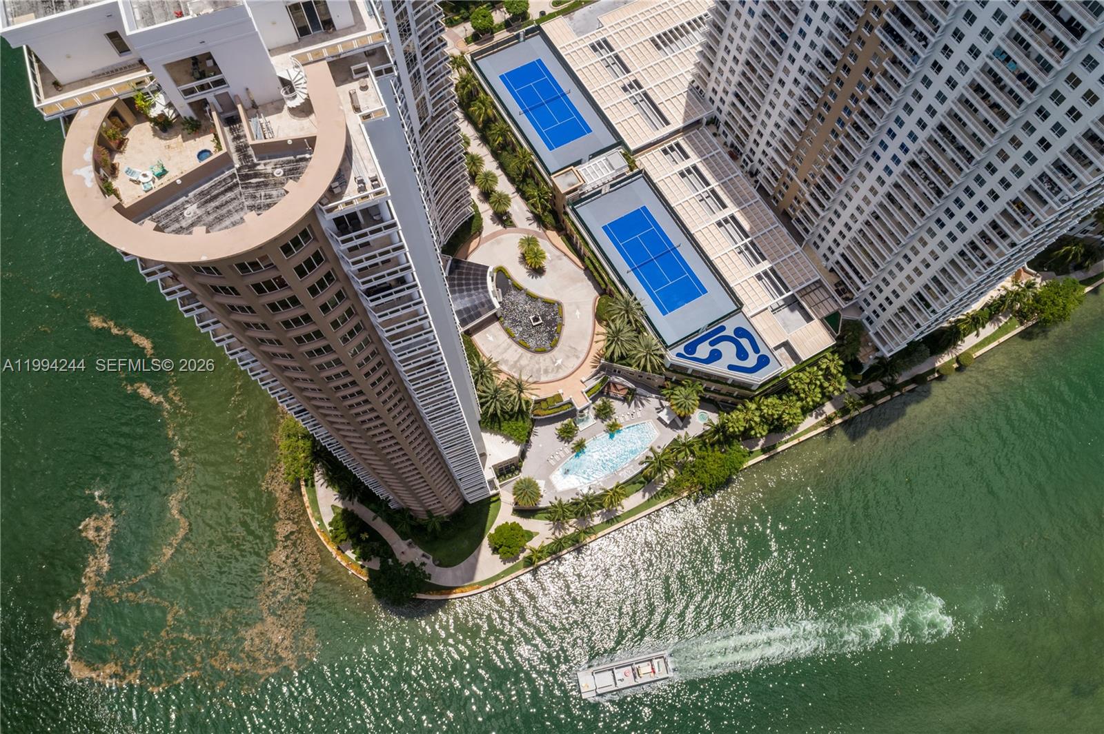 901 Brickell Key Boulevard, Unit 305 Miami, FL 33131 - Photo 4 of 31 an aerial view of a house with a swimming pool and outdoor space