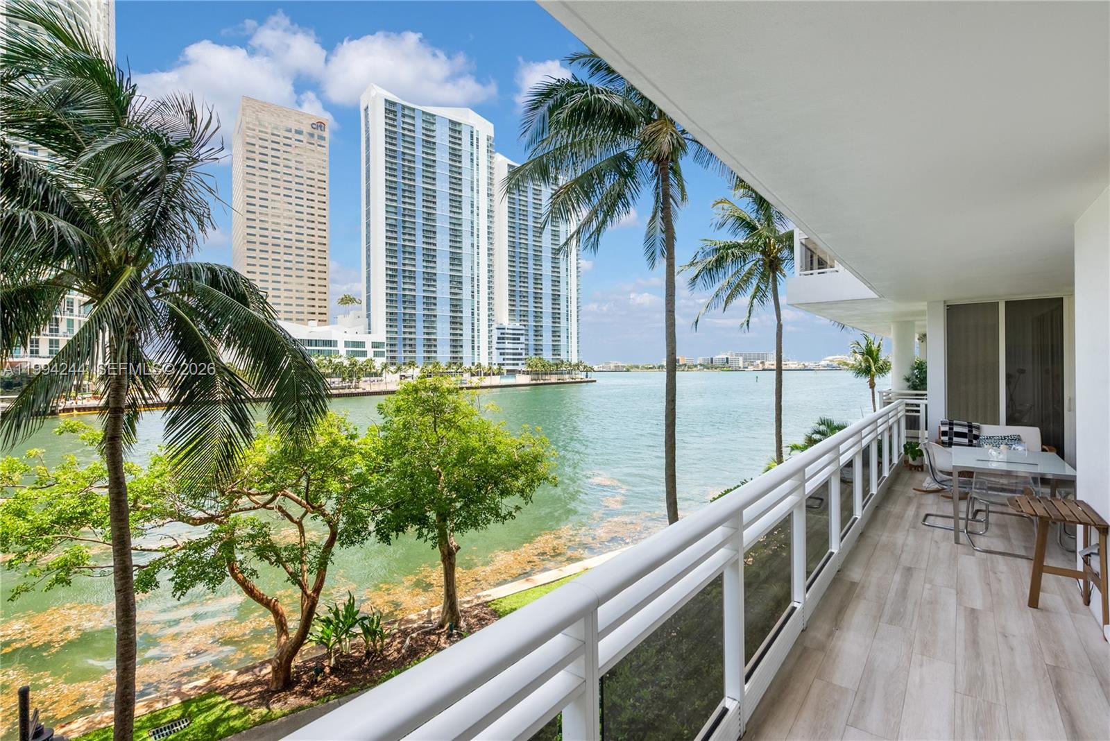 901 Brickell Key Boulevard, Unit 305 Miami, FL 33131 - Photo 6 of 31 a view of balcony with wooden floor and fence
