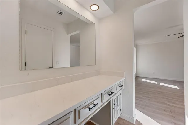 a view of cabinets with wooden floor