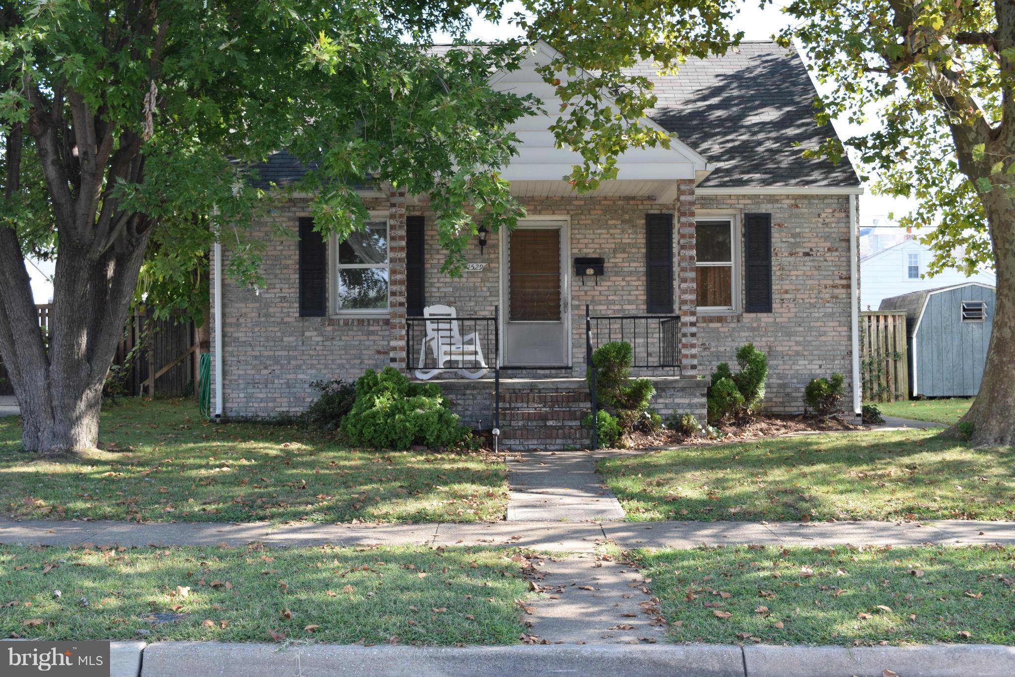1529 Leslie Road Baltimore, MD 21222 - Photo 1 of 23 front view of a house with a yard