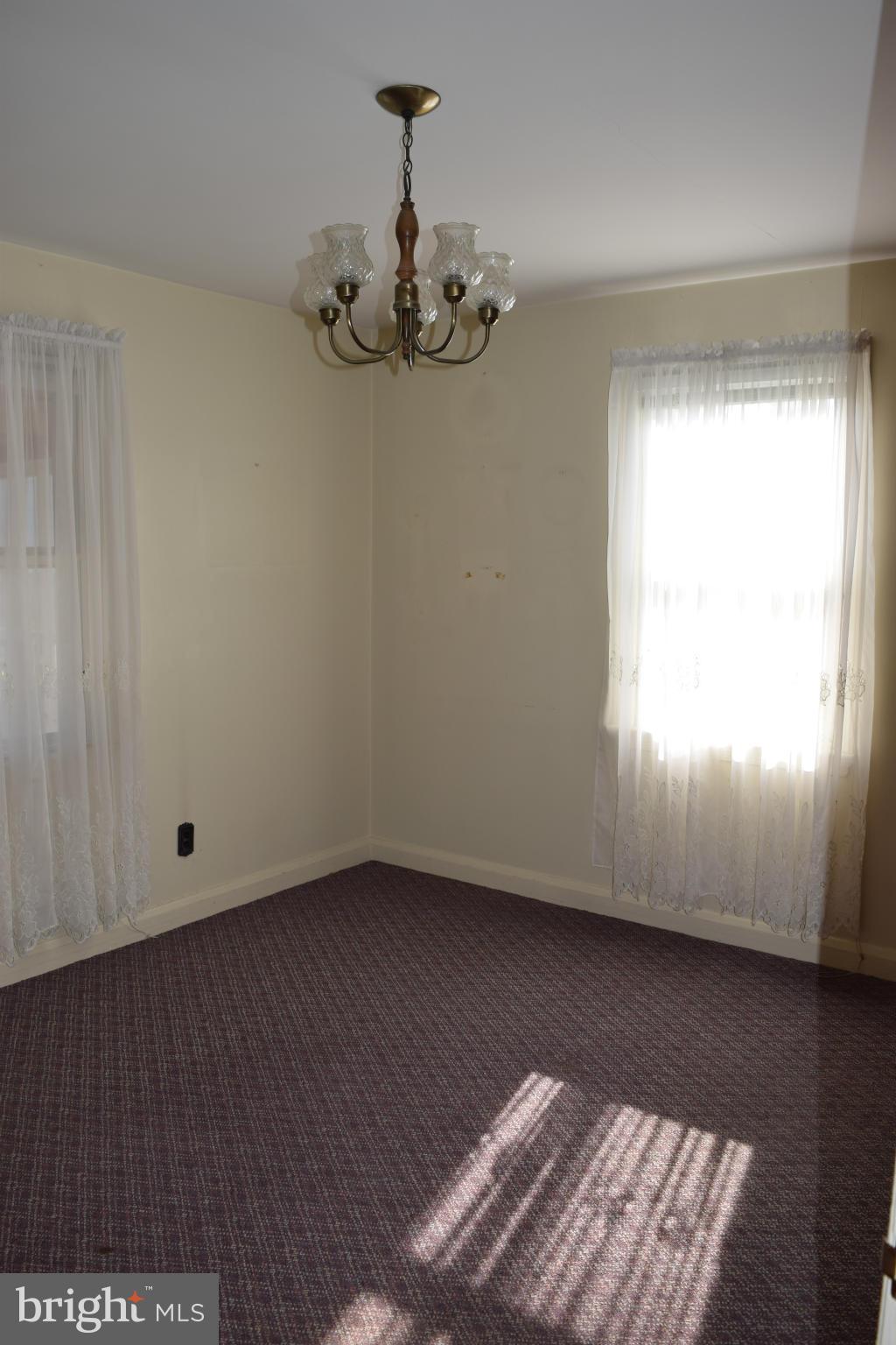 1529 Leslie Road Baltimore, MD 21222 - Photo 12 of 23 a view of room with window and wooden floor