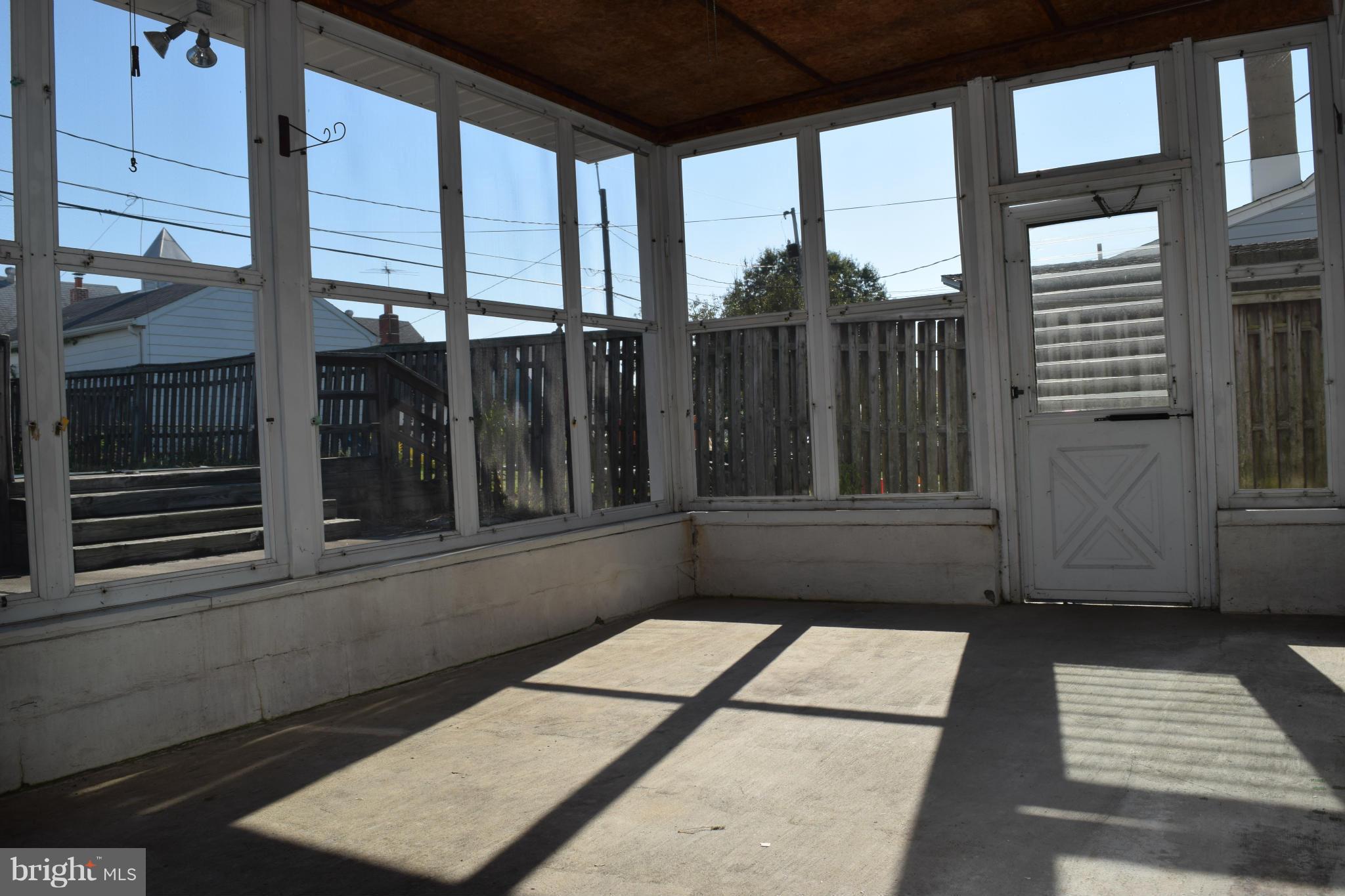1529 Leslie Road Baltimore, MD 21222 - Photo 23 of 23 a view of a balcony with a potted plant