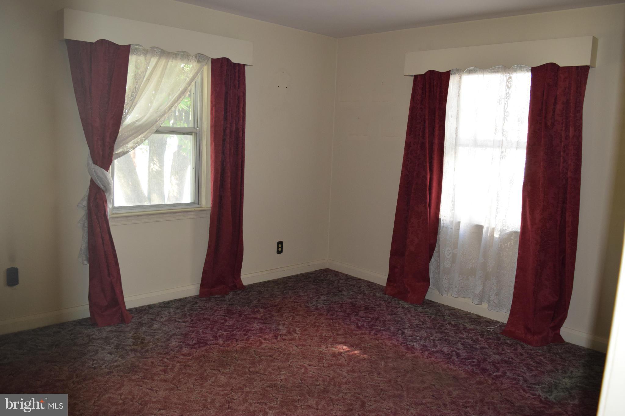 1529 Leslie Road Baltimore, MD 21222 - Photo 10 of 23 a view of empty room with windows