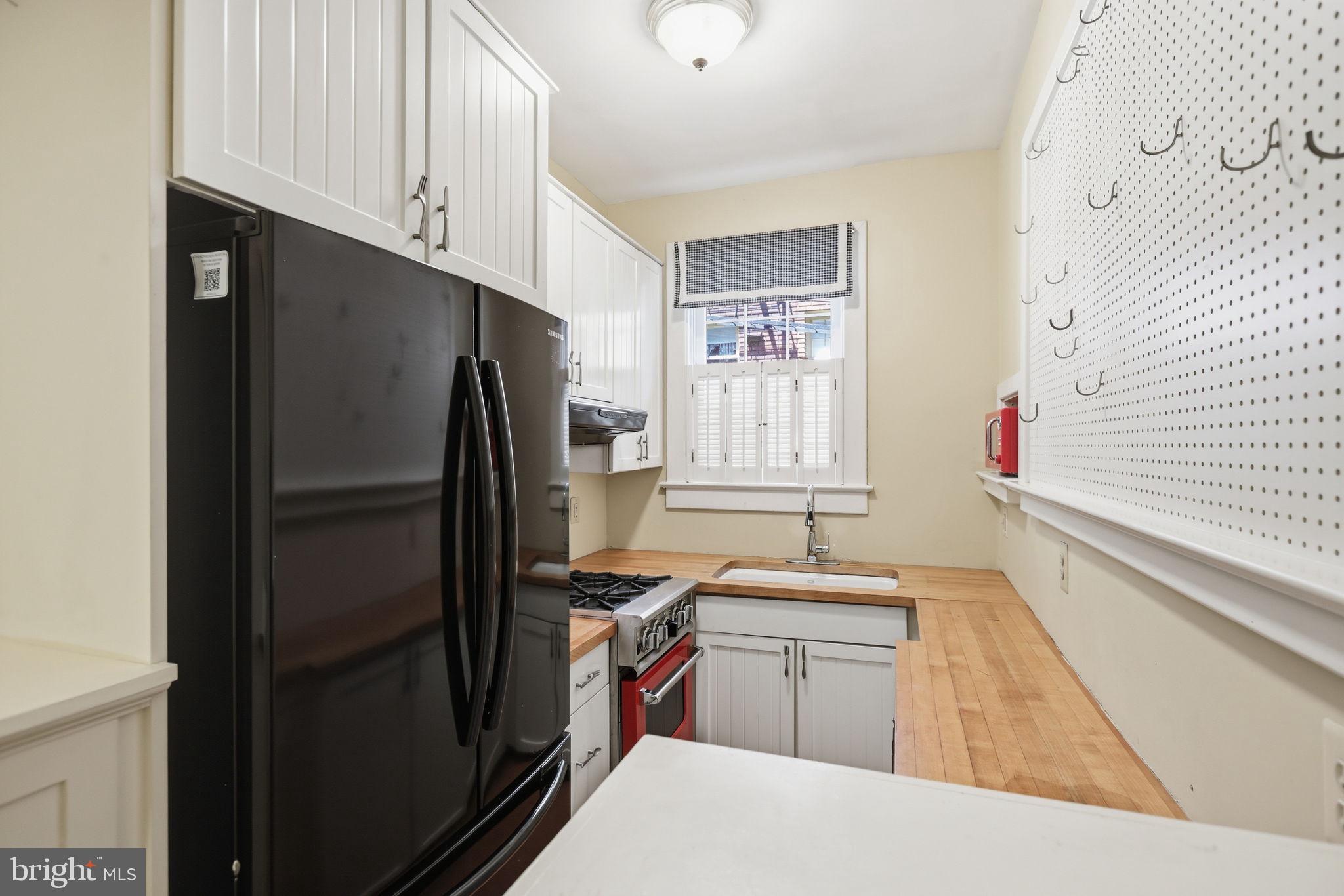 3018 Porter Street Northwest, Unit 103 Washington, DC 20008 - Photo 15 of 27 Charming kitchen with modern touches.