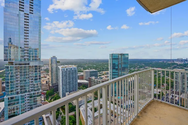 a view of a balcony with city view