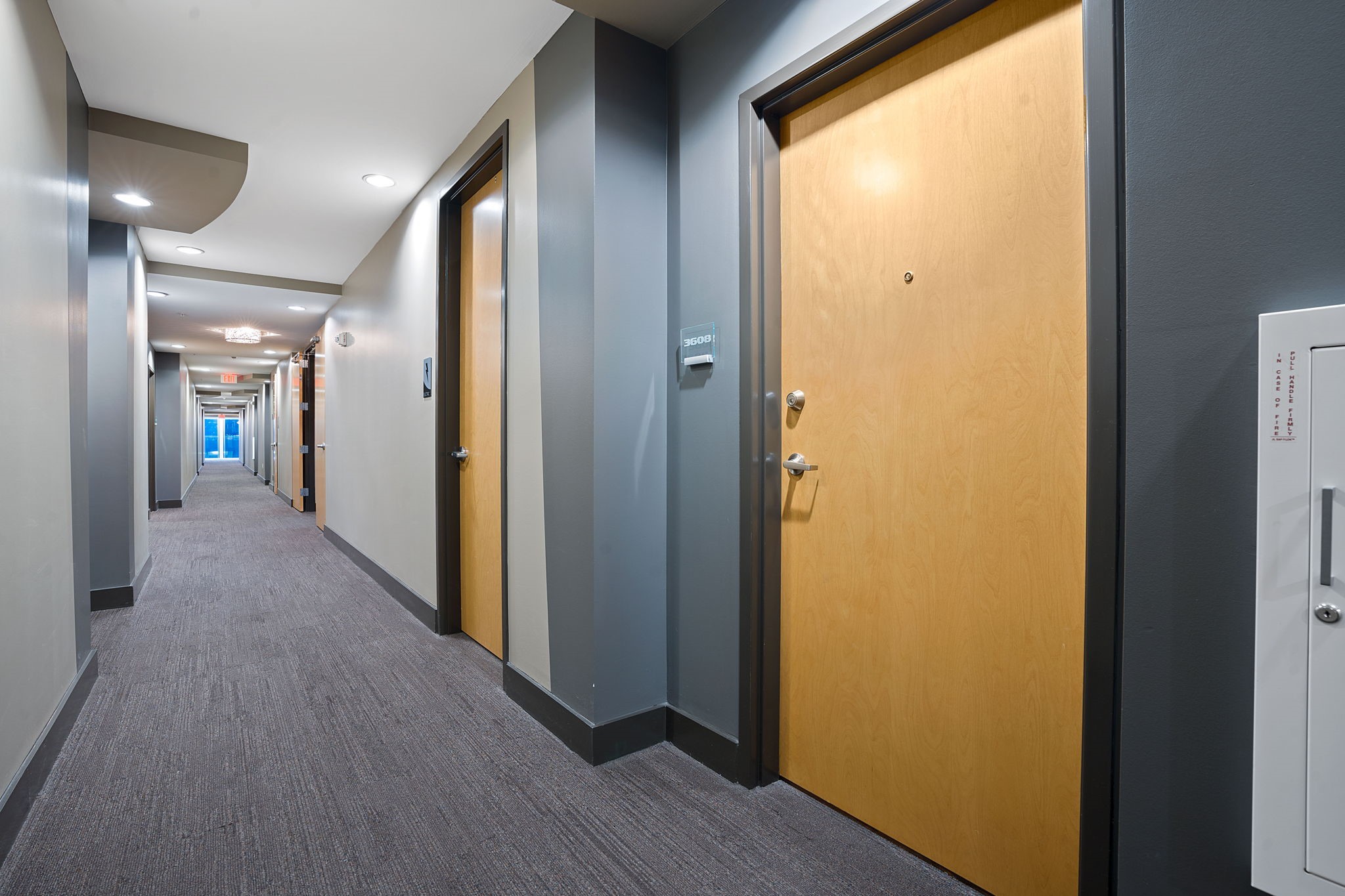360 Nueces Street, Unit 3608 Austin, TX 78701 - Photo 24 of 40 a view of a hallway with wooden floor