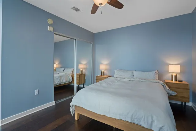 a bedroom with a bed and a chandelier