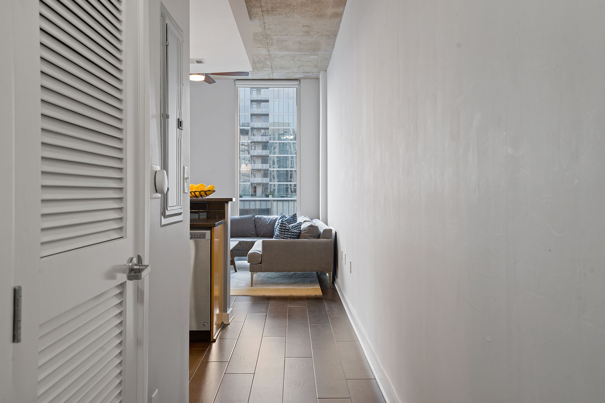 360 Nueces Street, Unit 3608 Austin, TX 78701 - Photo 10 of 40 a view of bedroom with furniture and wooden floor