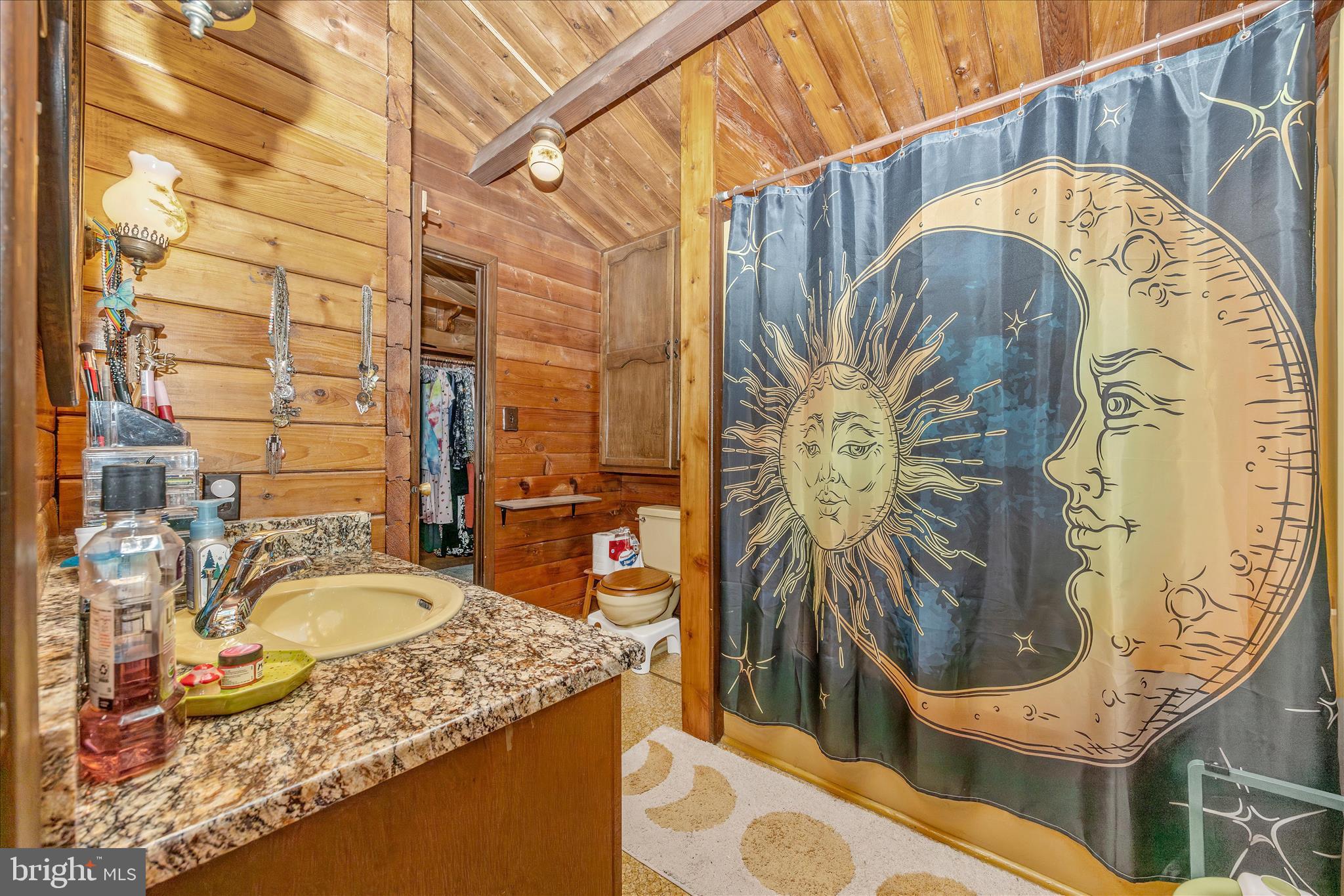 12644 Jesse Smith Road Mount Airy, MD 21771 - Photo 14 of 31 a bathroom with a granite countertop sink and a mirror