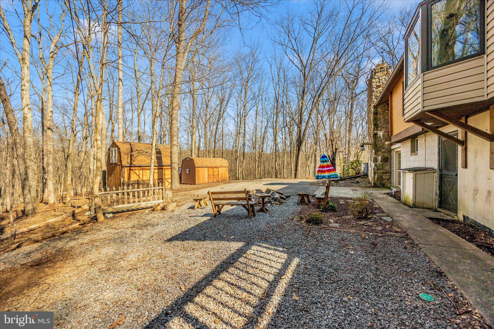 12644 Jesse Smith Road Mount Airy, MD 21771 - Photo 8 of 31 a backyard of a house with wooden fence and large trees