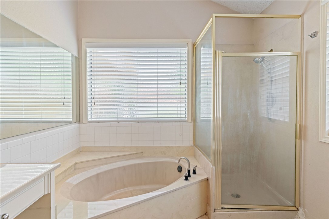 7209 Candy Ridge Road Corpus Christi, TX 78413 - Photo 21 of 24 a white bath tub sitting next to a window