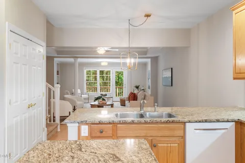 a living room with furniture fireplace and a large window