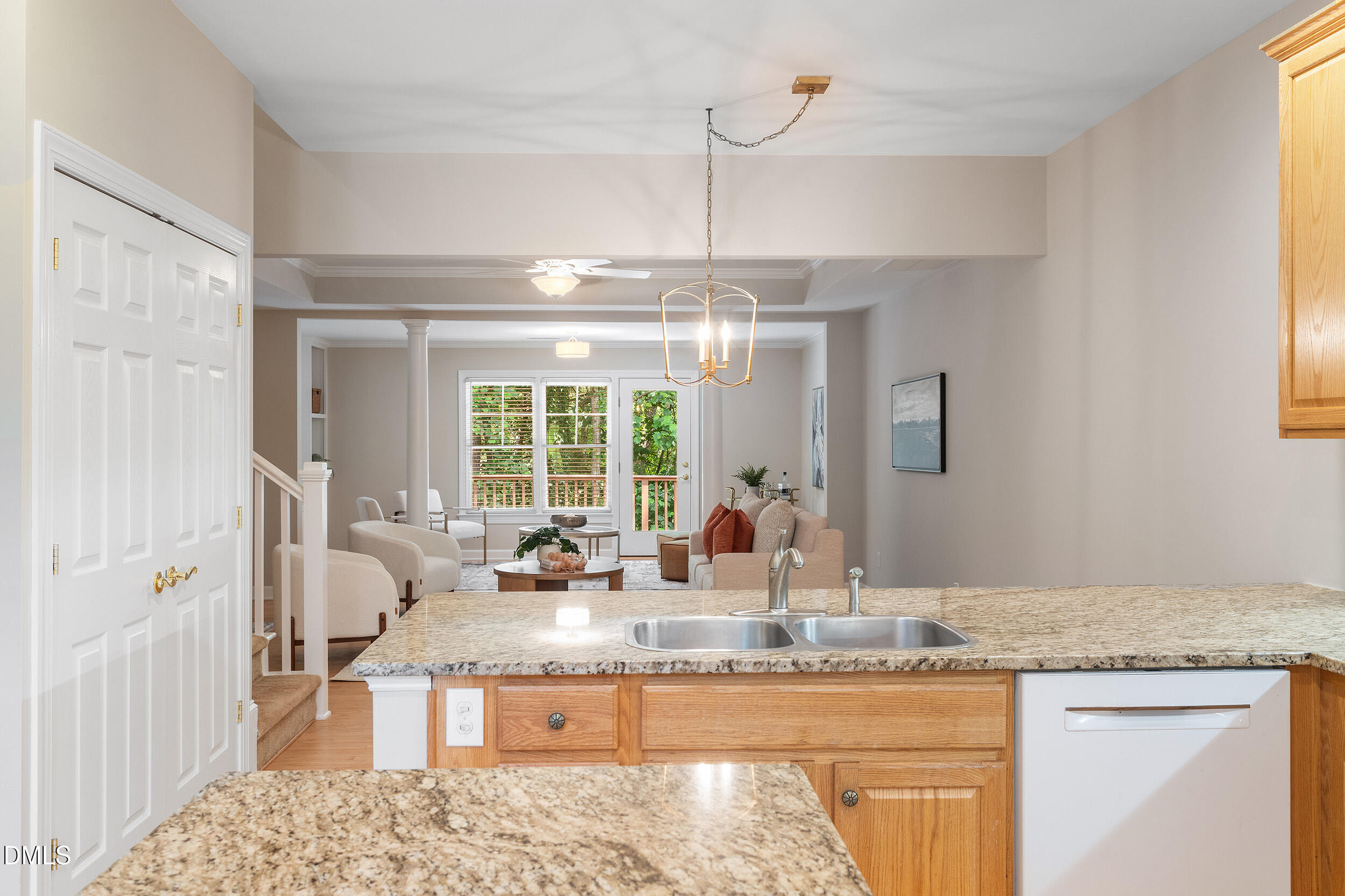 4724 Ludwell Branch Court Raleigh, NC 27612 - Photo 14 of 72 a kitchen with granite countertop a sink and dishwasher with white cabinets