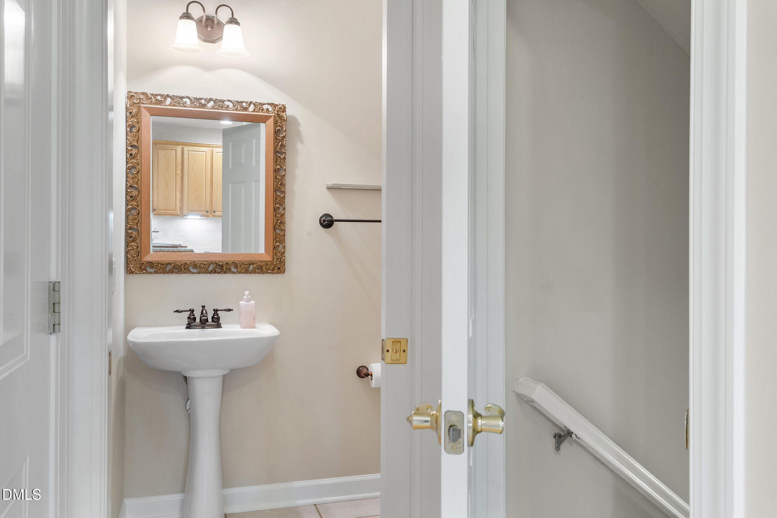 4724 Ludwell Branch Court Raleigh, NC 27612 - Photo 17 of 72 a bathroom with a sink and a mirror
