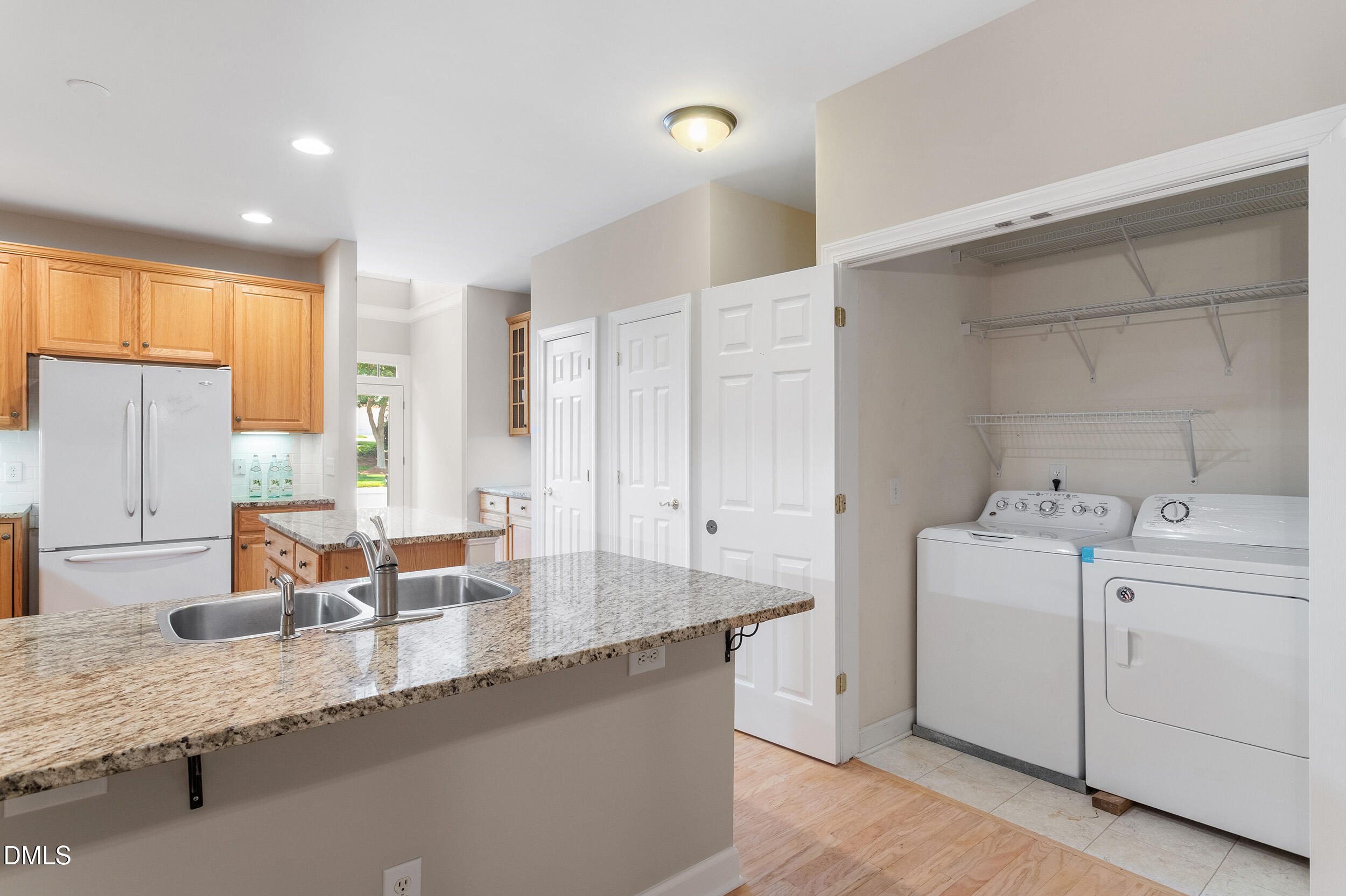 4724 Ludwell Branch Court Raleigh, NC 27612 - Photo 18 of 72 a dining hall with stainless steel appliances granite countertop a sink a stove and a refrigerator