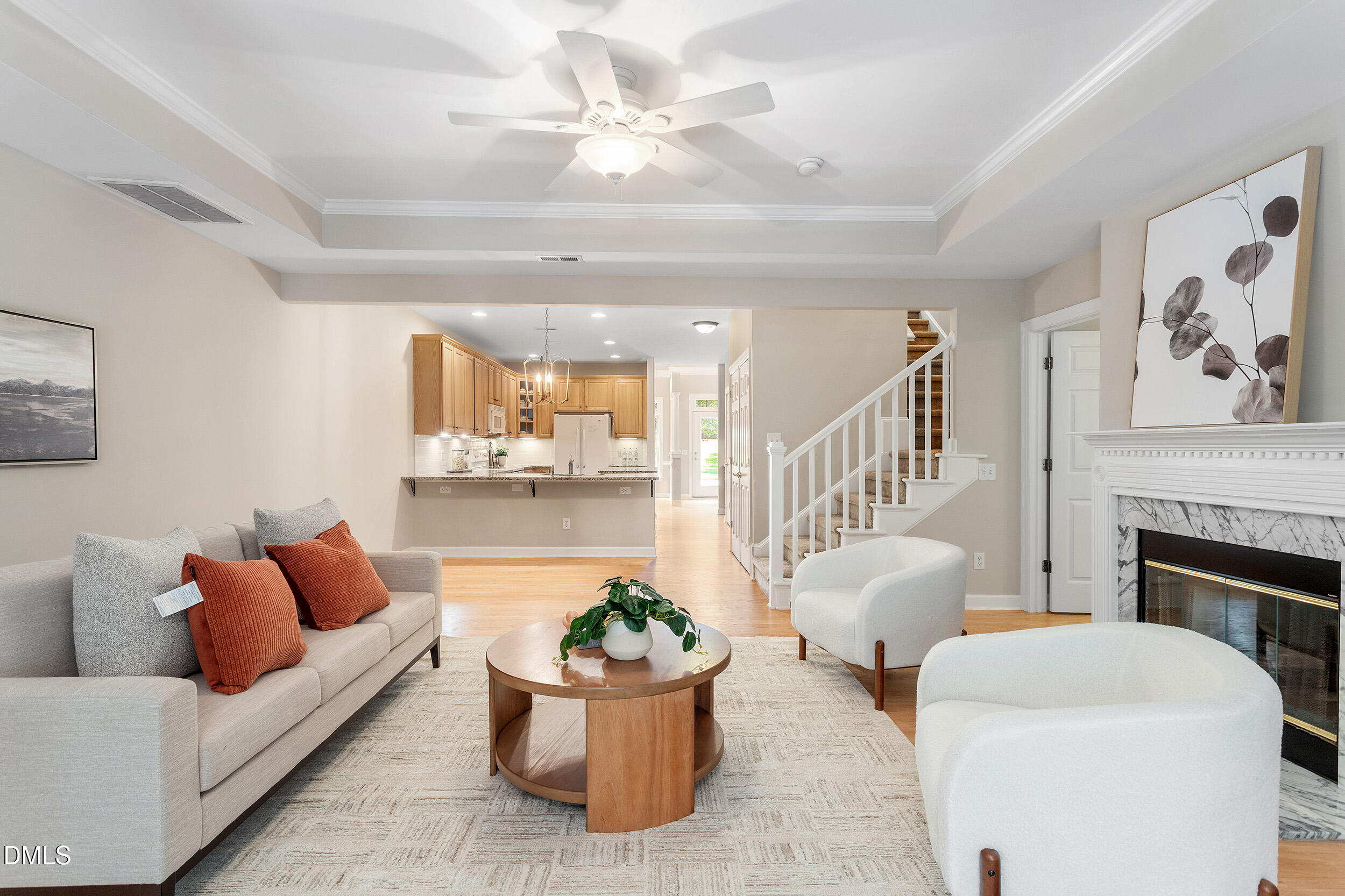 4724 Ludwell Branch Court Raleigh, NC 27612 - Photo 24 of 72 a living room with furniture and a fireplace