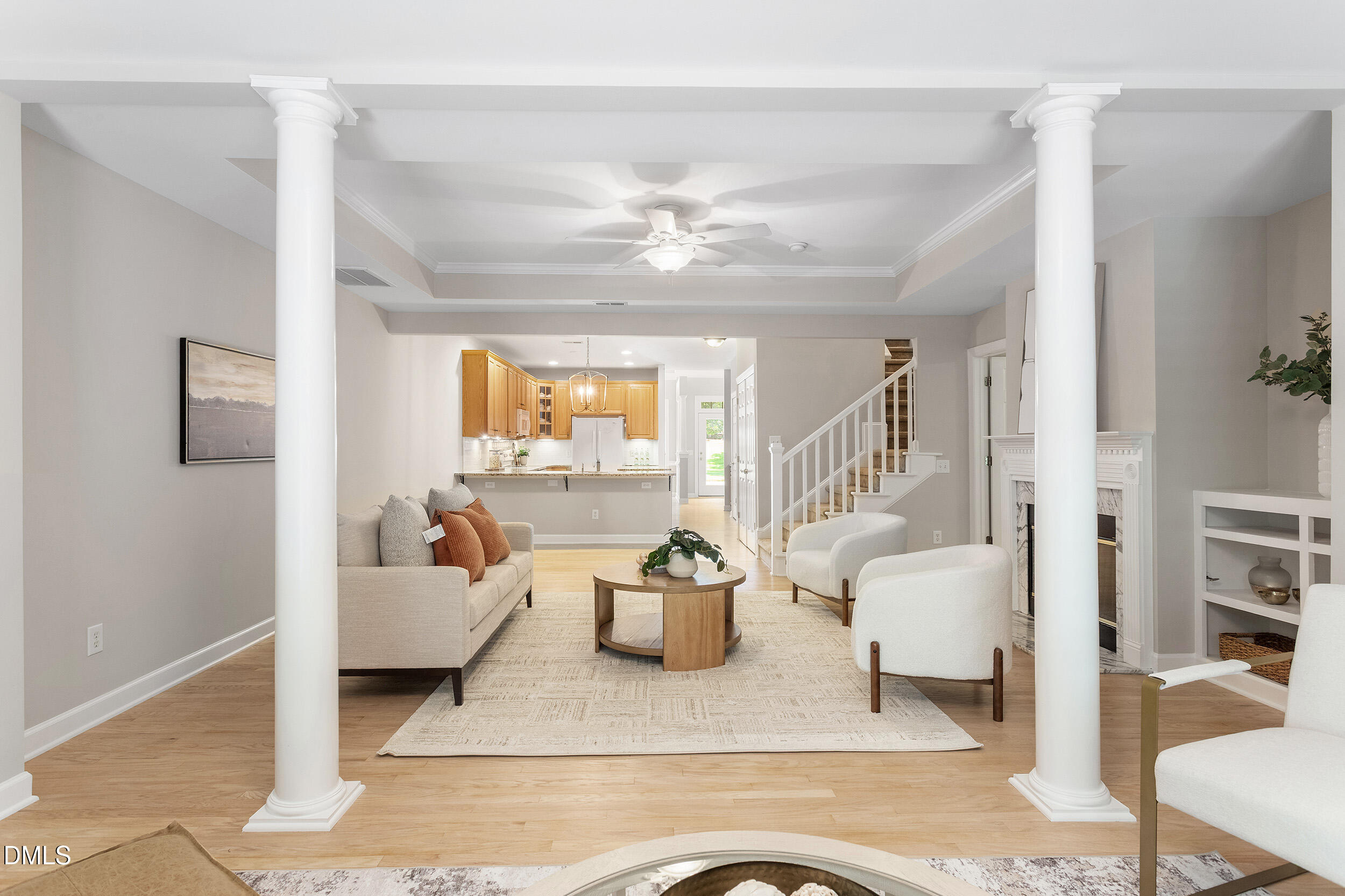 4724 Ludwell Branch Court Raleigh, NC 27612 - Photo 26 of 72 a living room with furniture and a chandelier