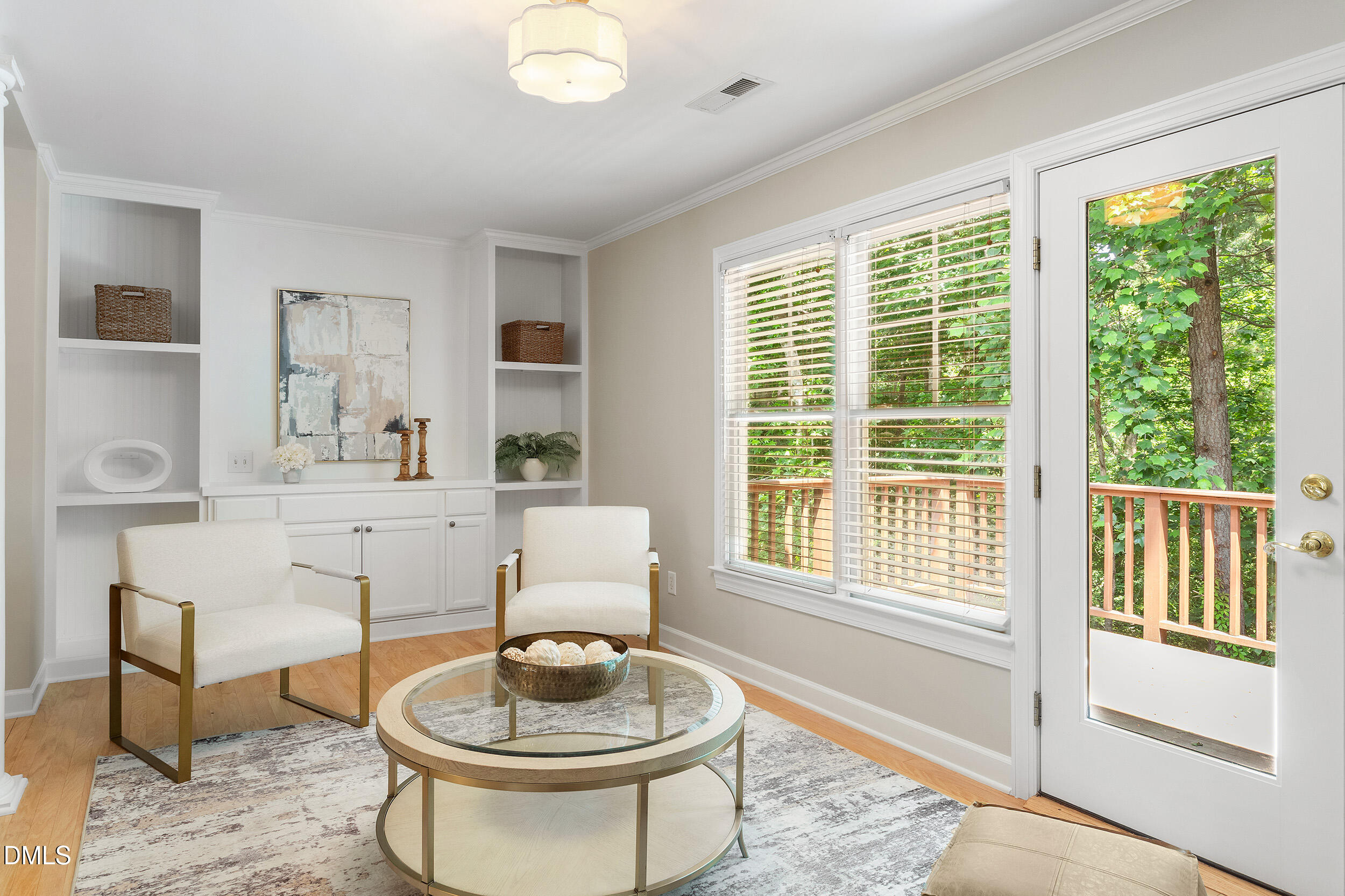4724 Ludwell Branch Court Raleigh, NC 27612 - Photo 28 of 72 a living room with furniture and a large window