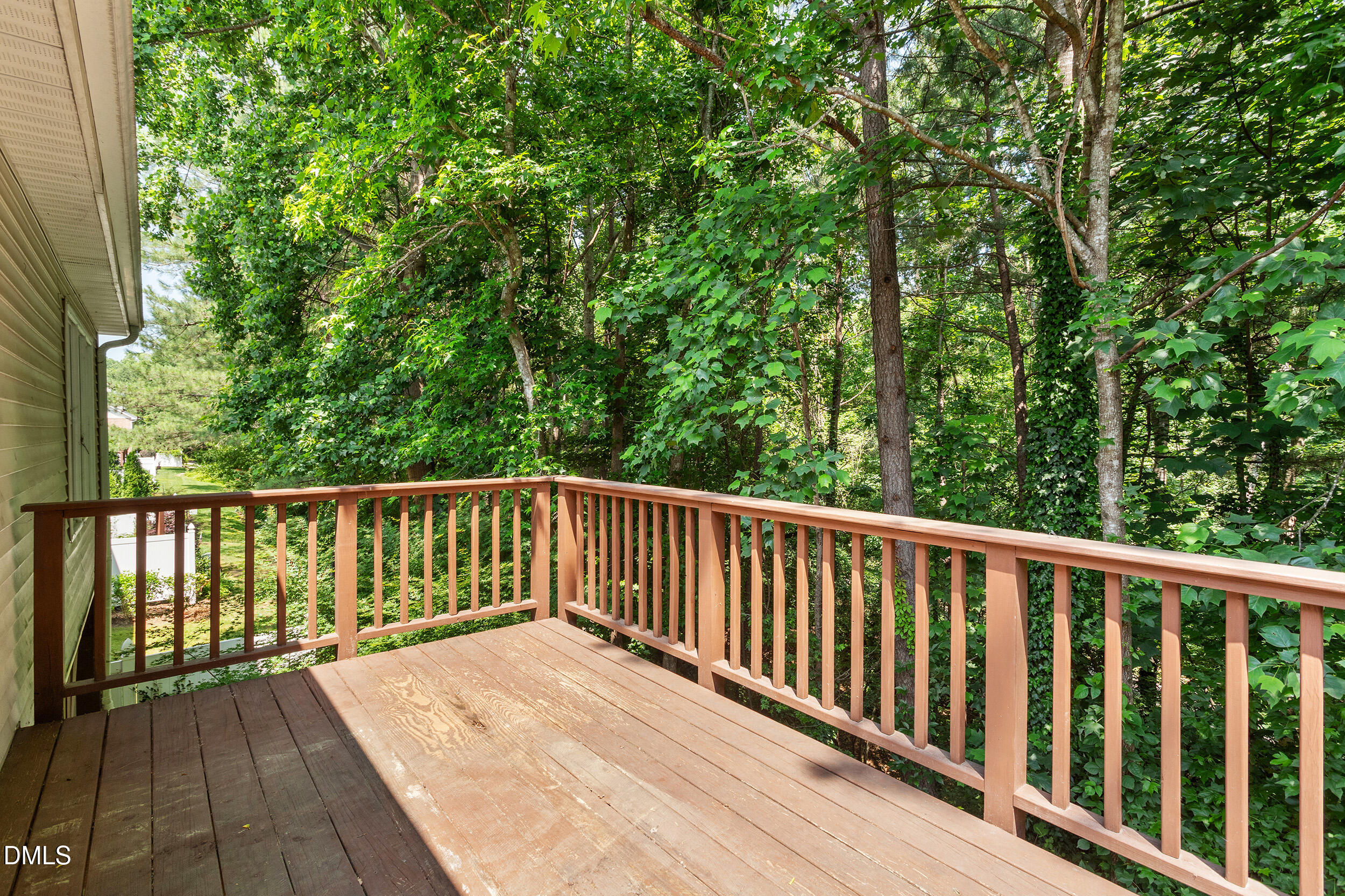 4724 Ludwell Branch Court Raleigh, NC 27612 - Photo 31 of 72 a balcony with wooden floor and fence