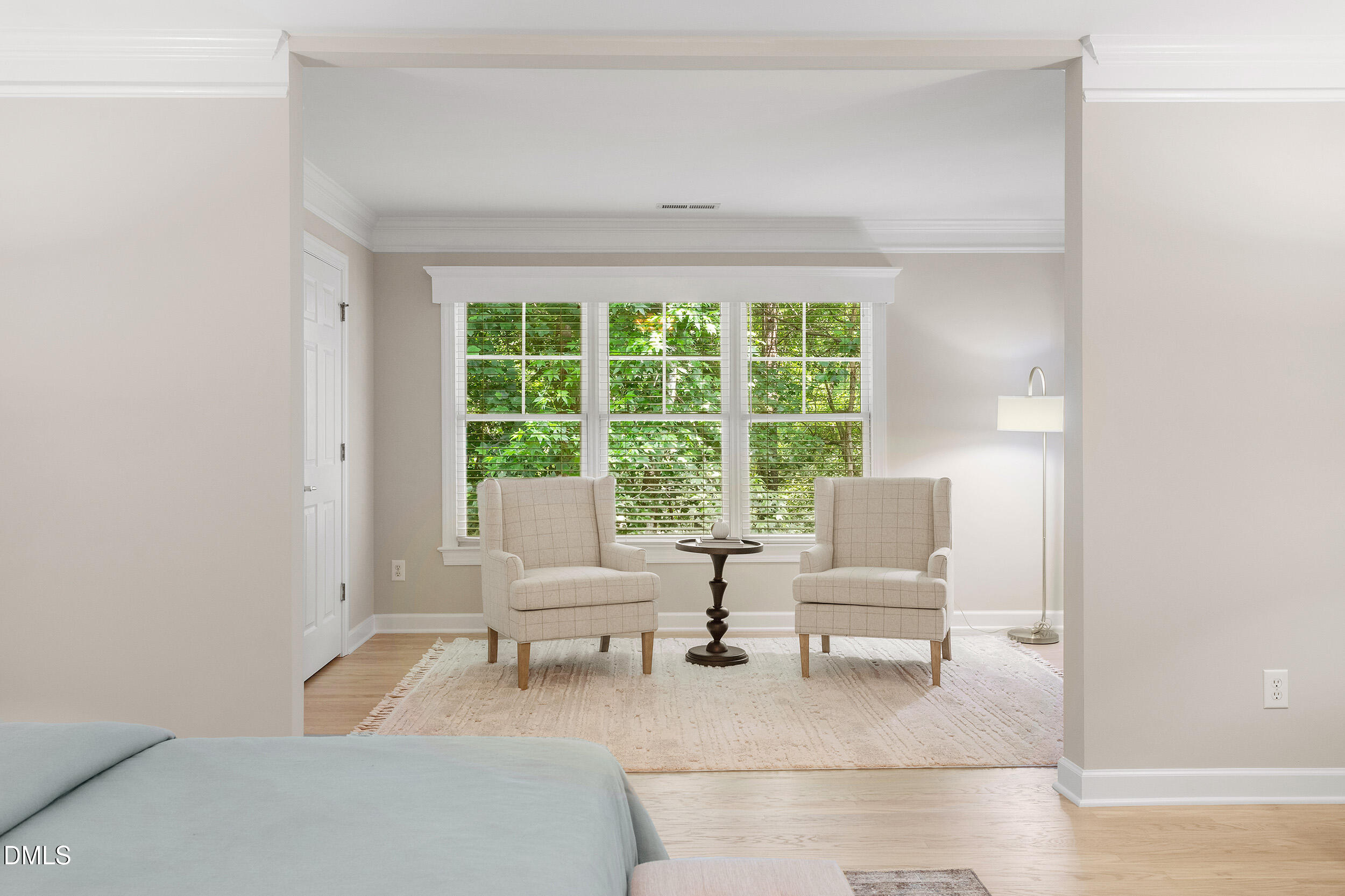 4724 Ludwell Branch Court Raleigh, NC 27612 - Photo 37 of 72 a living room with furniture and a large window