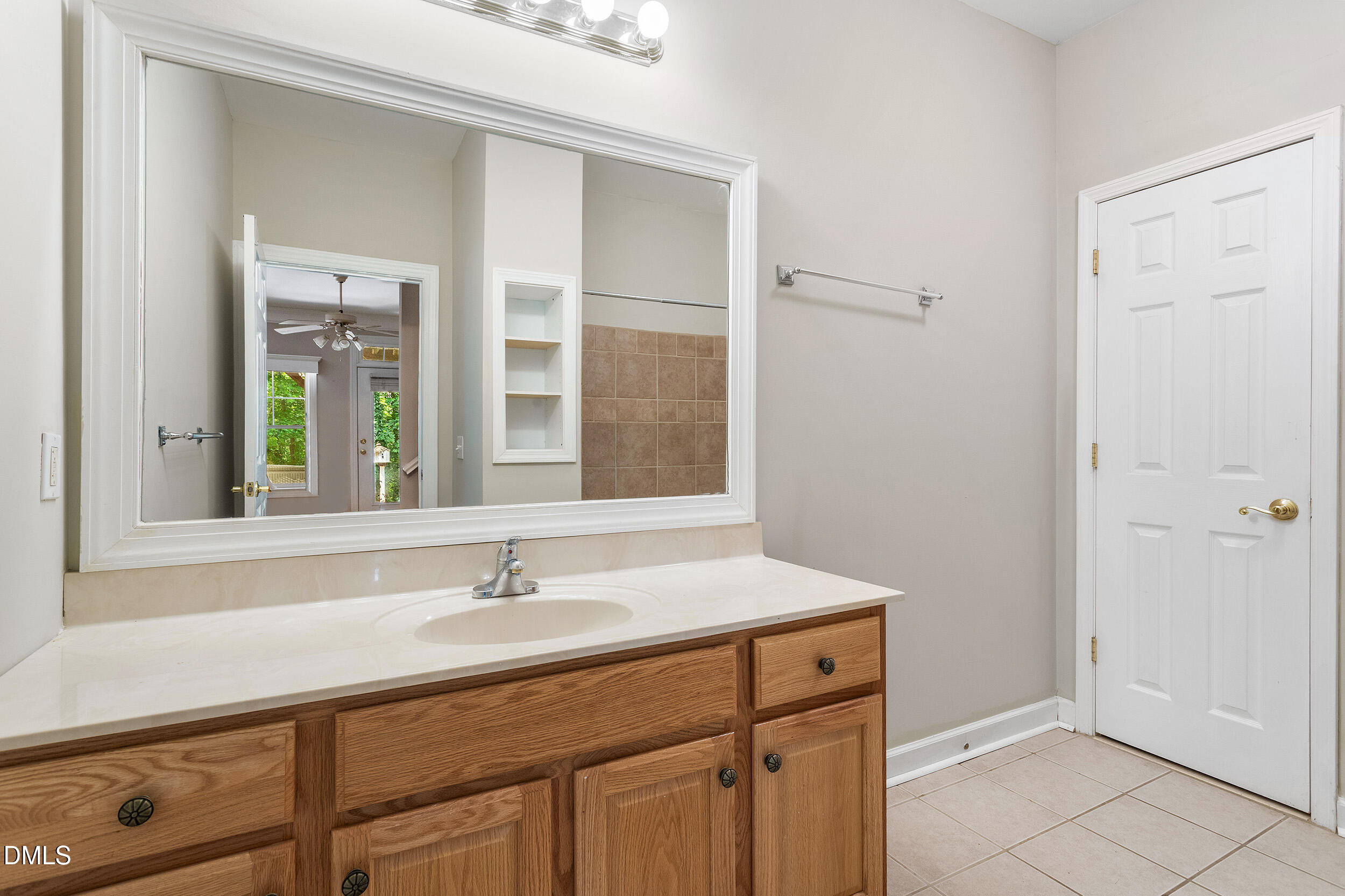 4724 Ludwell Branch Court Raleigh, NC 27612 - Photo 43 of 72 a sink with a mirror