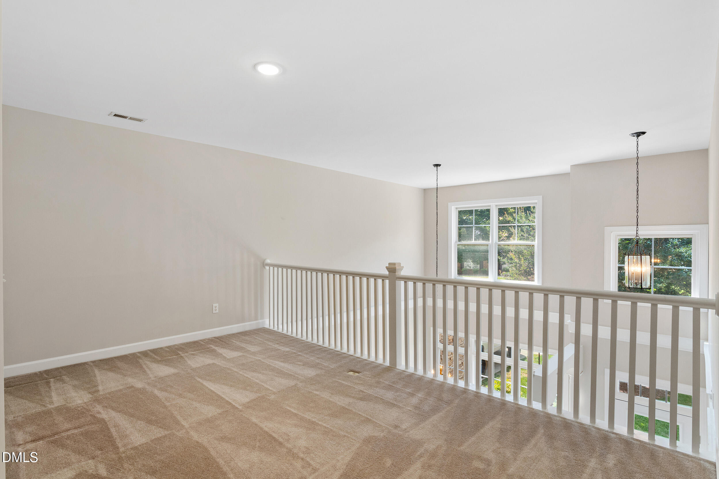 4724 Ludwell Branch Court Raleigh, NC 27612 - Photo 45 of 72 a view of a room with a balcony