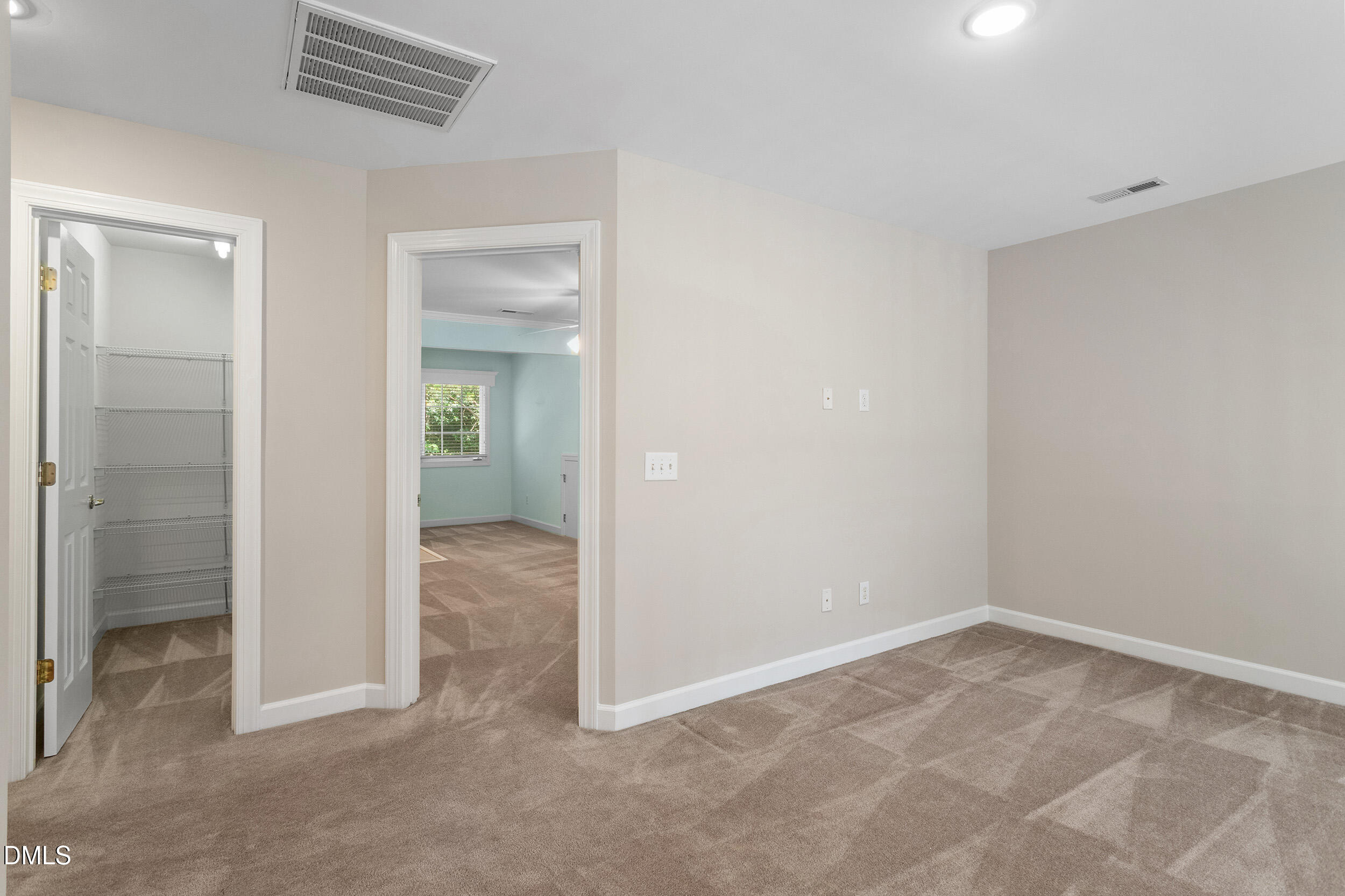 4724 Ludwell Branch Court Raleigh, NC 27612 - Photo 46 of 72 an empty room with closet and a bathroom