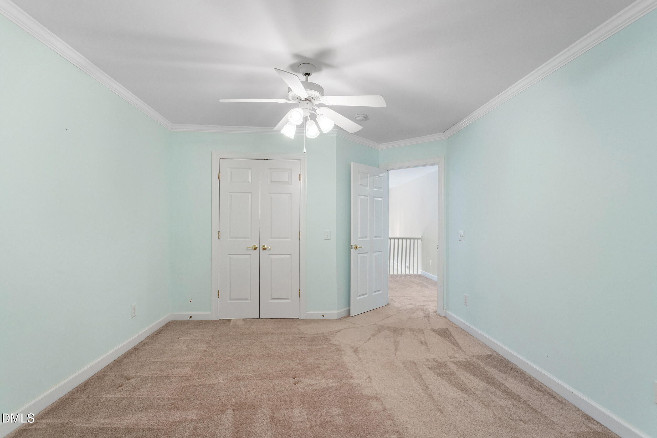 4724 Ludwell Branch Court Raleigh, NC 27612 - Photo 48 of 72 a view of an empty room with a fan