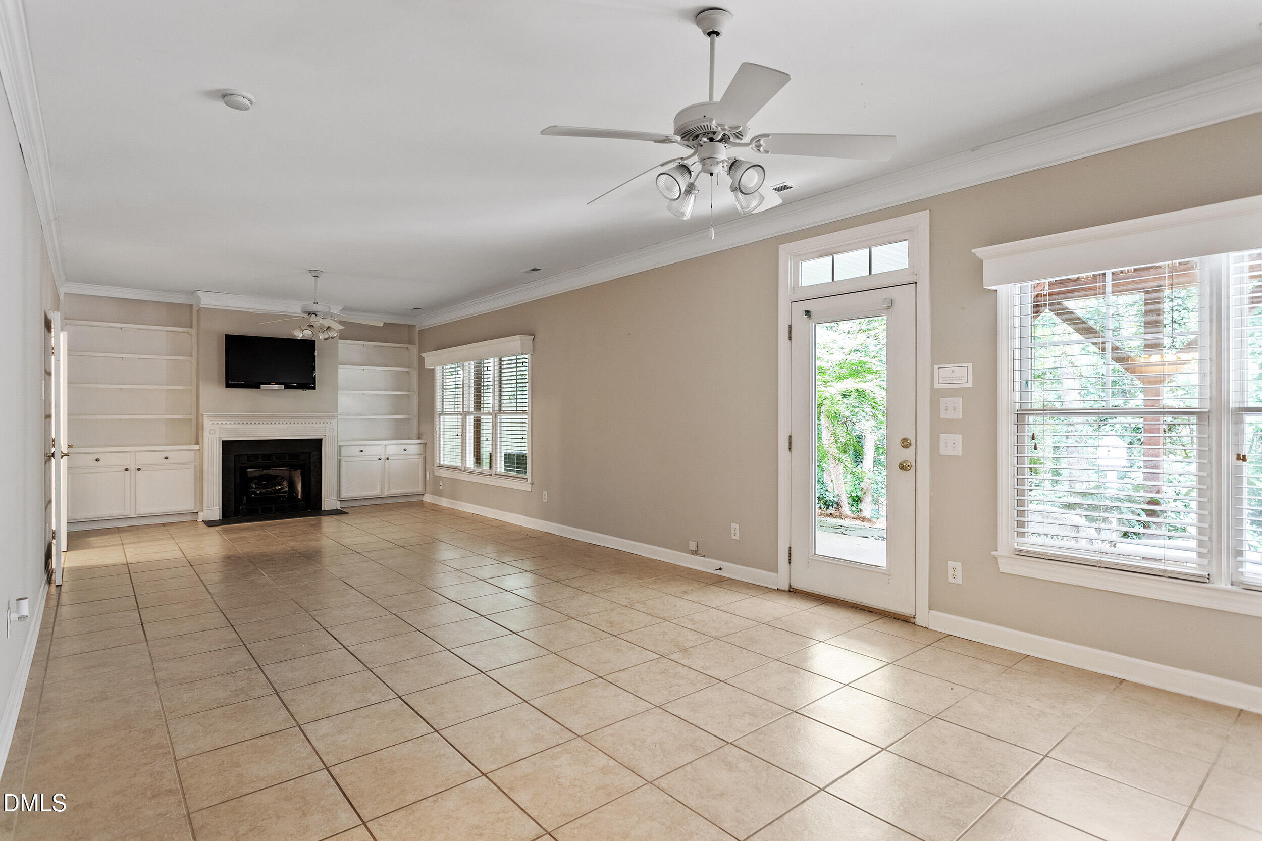 4724 Ludwell Branch Court Raleigh, NC 27612 - Photo 56 of 72 a view of an empty room with window and fire place