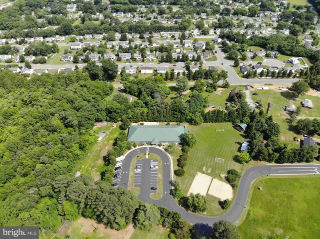an aerial view of a house with a swimming pool yard and outdoor seating