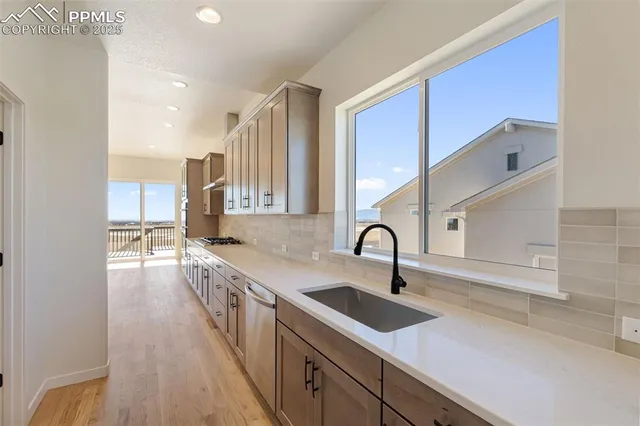 a kitchen with a sink and cabinets