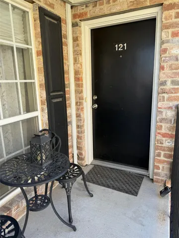 a view of entryway with wooden door