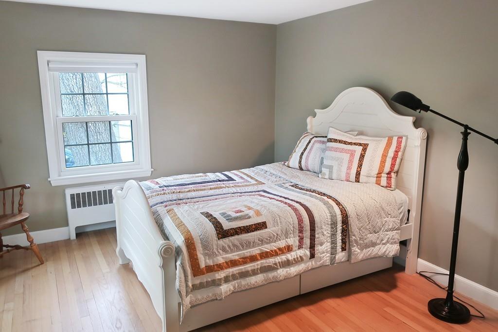 11 Prospect Hill Road Lexington, MA 02421 - Photo 16 of 24 a bed sitting in a bedroom next to a window