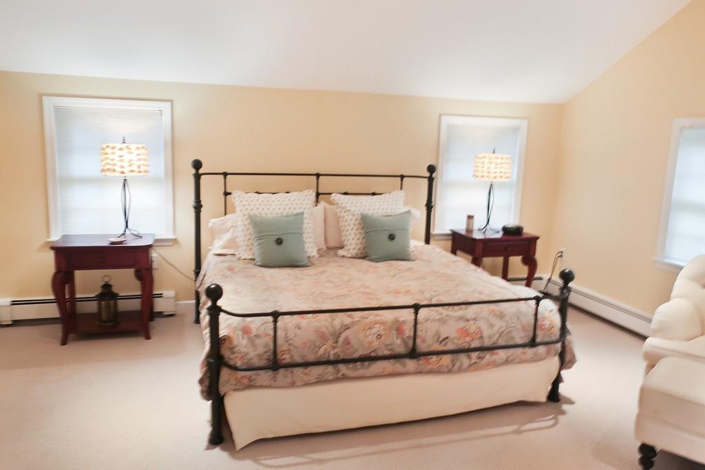 11 Prospect Hill Road Lexington, MA 02421 - Photo 9 of 24 a bedroom with a bed chair and a mirror