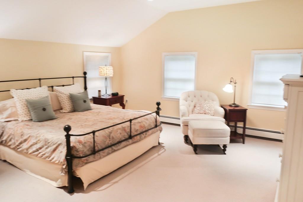11 Prospect Hill Road Lexington, MA 02421 - Photo 10 of 24 a bedroom with a bed and lamp
