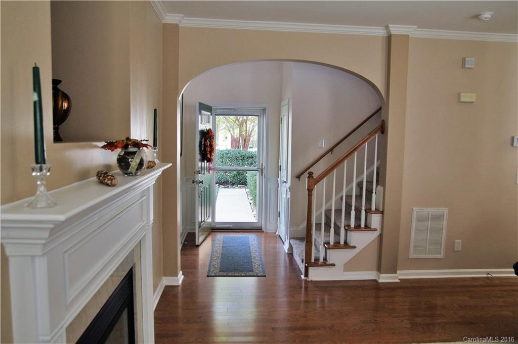 3908 Caliper Place, Unit 325 Fort Mill, SC 29708 - Photo 11 of 24 a view of a hallway with wooden floor and staircase