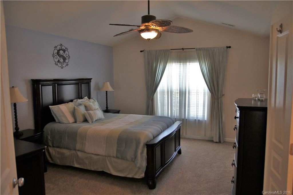 3908 Caliper Place, Unit 325 Fort Mill, SC 29708 - Photo 13 of 24 a bedroom with a bed and window