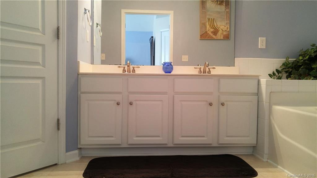 3908 Caliper Place, Unit 325 Fort Mill, SC 29708 - Photo 15 of 24 a bathroom with a sink and a mirror