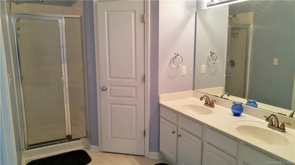 3908 Caliper Place, Unit 325 Fort Mill, SC 29708 - Photo 17 of 24 a bathroom with a sink and a mirror