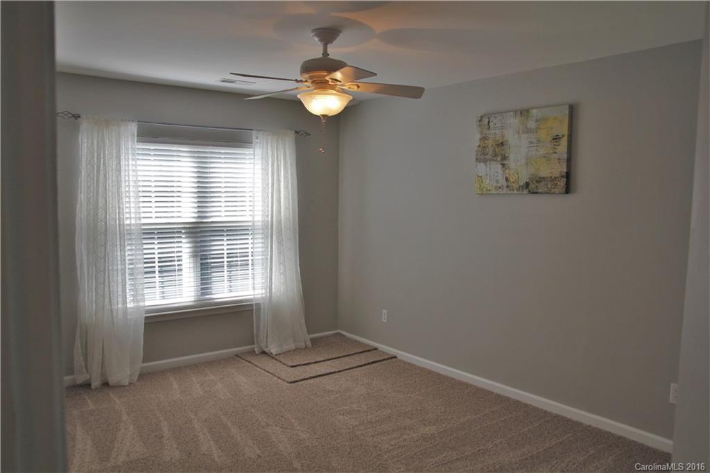 3908 Caliper Place, Unit 325 Fort Mill, SC 29708 - Photo 19 of 24 a view of an empty room with a window