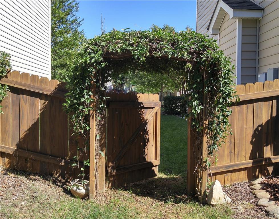 3908 Caliper Place, Unit 325 Fort Mill, SC 29708 - Photo 23 of 24 a view of a backyard