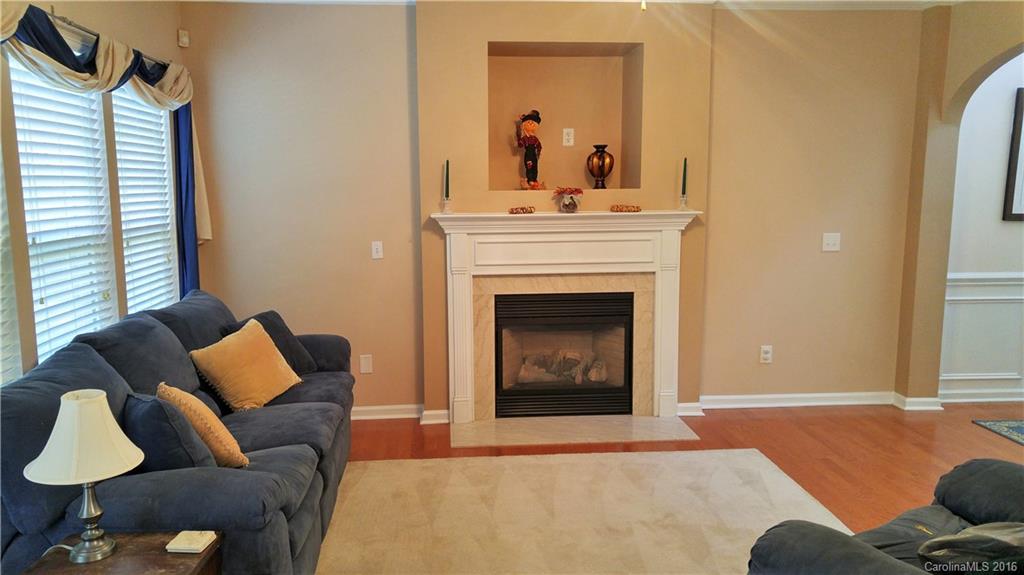3908 Caliper Place, Unit 325 Fort Mill, SC 29708 - Photo 5 of 24 a living room with furniture and a fireplace
