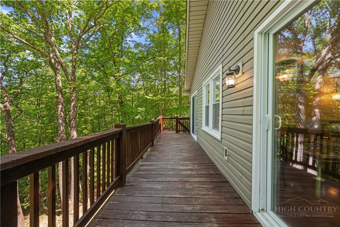 467 Horseshoe Ridge Road East Deep Gap, NC 28618 - Photo 6 of 46 a view of balcony with wooden floor