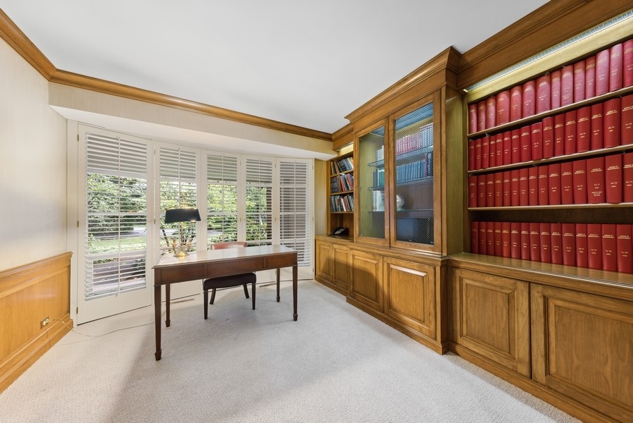 321 Oak Brook Road Oak Brook, IL 60523 - Photo 12 of 40 a work room with furniture a bookshelf and a large window