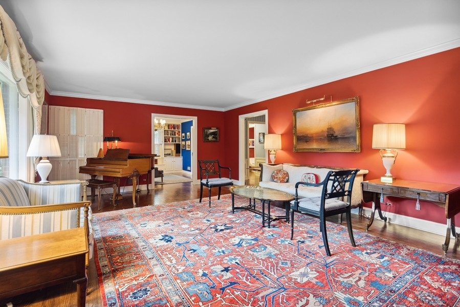 321 Oak Brook Road Oak Brook, IL 60523 - Photo 14 of 40 a living room with furniture a rug and a large window