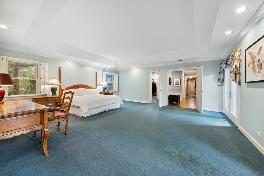 321 Oak Brook Road Oak Brook, IL 60523 - Photo 19 of 40 a bedroom with furniture and a window