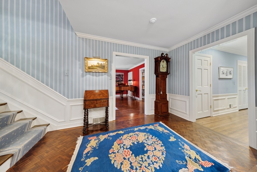 321 Oak Brook Road Oak Brook, IL 60523 - Photo 24 of 40 a living room with furniture and a rug