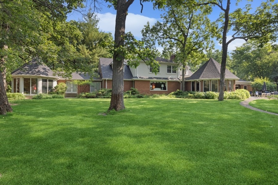321 Oak Brook Road Oak Brook, IL 60523 - Photo 29 of 40 a front view of a house with a yard